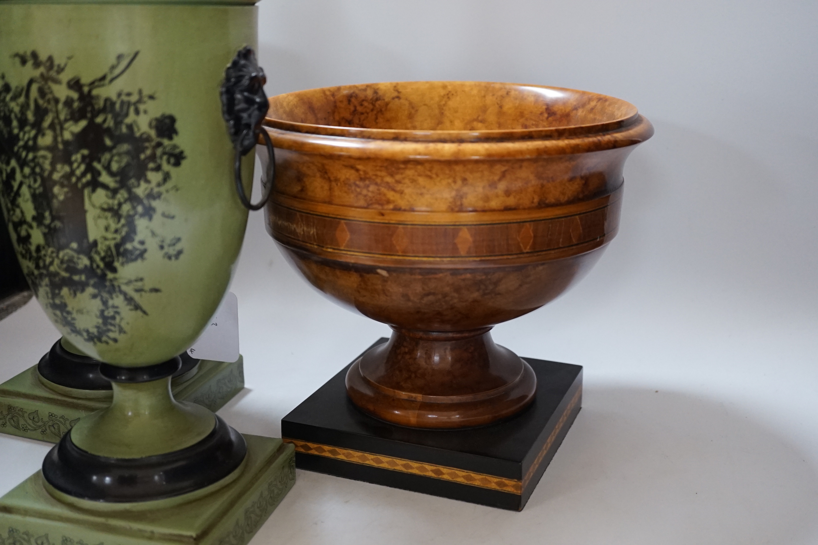 A pair of Toleware urns, a turned maple pedestal bowl and urn